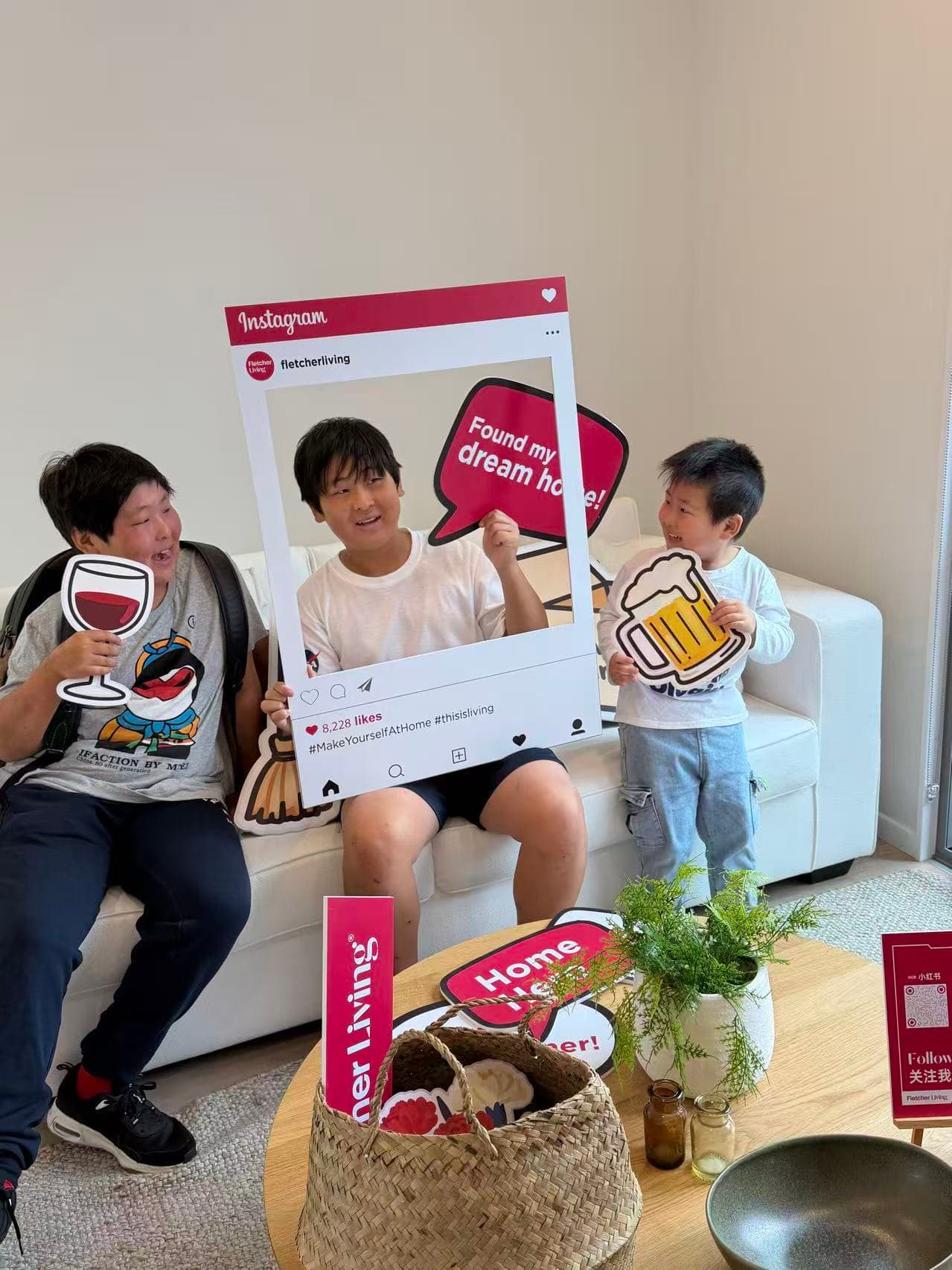 Family participating in a Fletcher Living community open-day photo activation