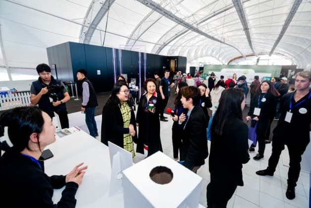 Busy Go China+ exhibition floor with brands, partners and visitors